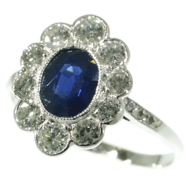 Vintage platinum Lady Di engagement ring with brilliant and sapphire